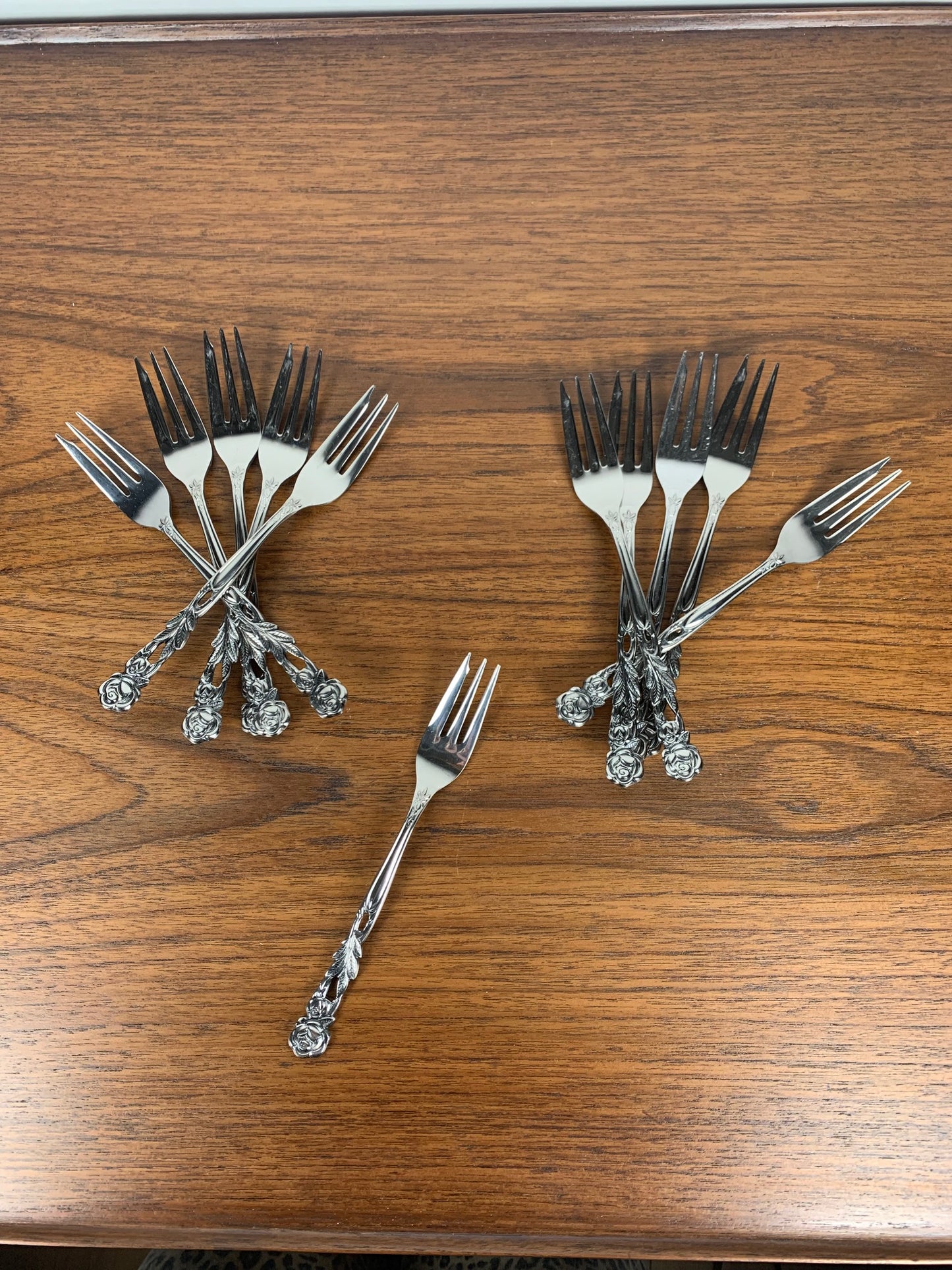 Set of 10+1 Japanese stainless steel dessert forks, rose pattern, 1970