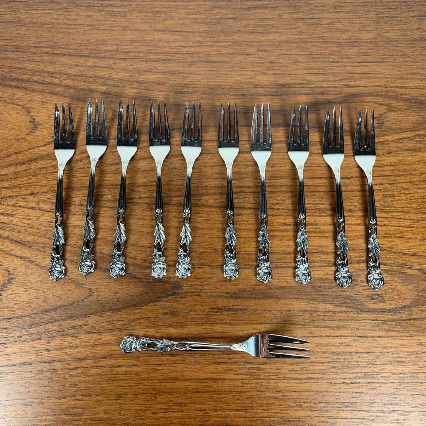 Set of 10+1 Japanese stainless steel dessert forks, rose pattern, 1970