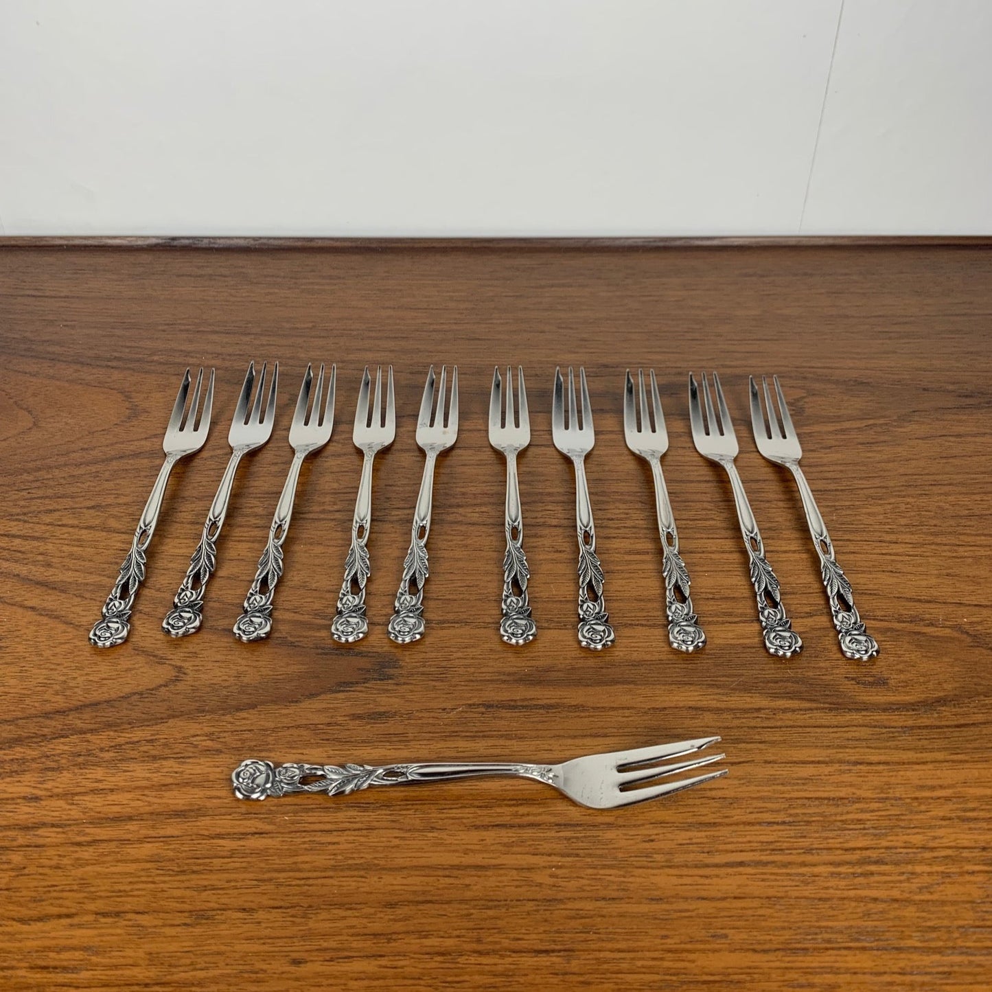 Set of 10+1 Japanese stainless steel dessert forks, rose pattern, 1970