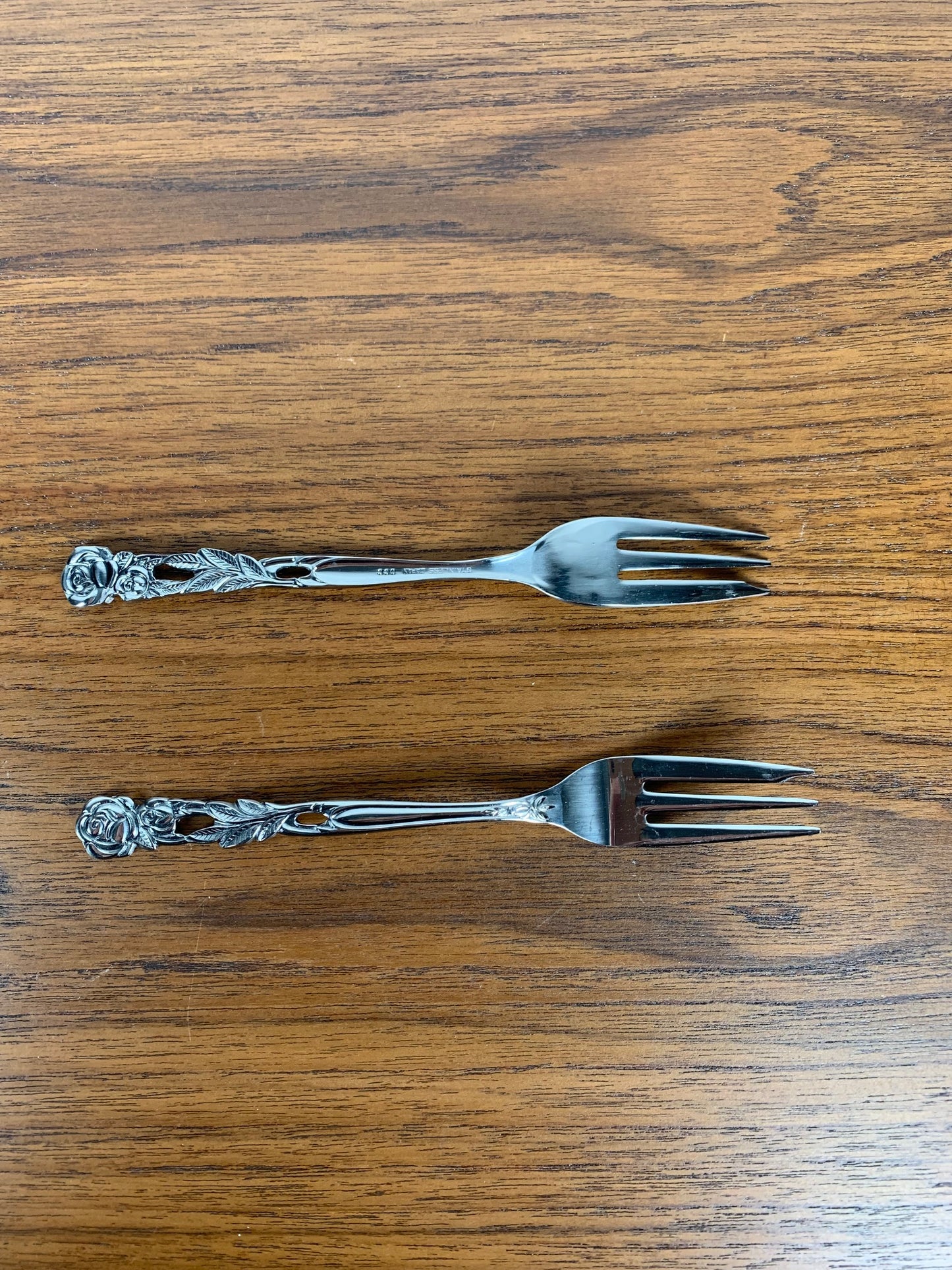 Set of 10+1 Japanese stainless steel dessert forks, rose pattern, 1970