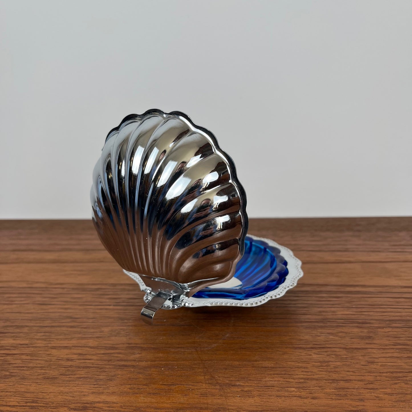 Silver-plated metal shell butter dish with blue insert, 1970