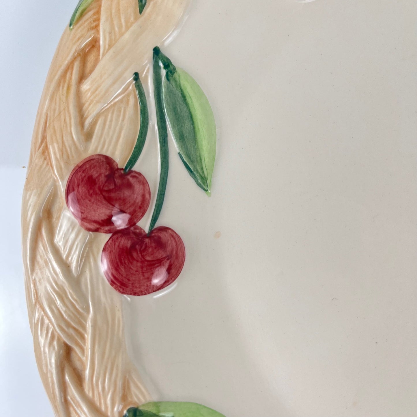 Antique earthenware dish with cherry pattern, signed "FG", 20th century