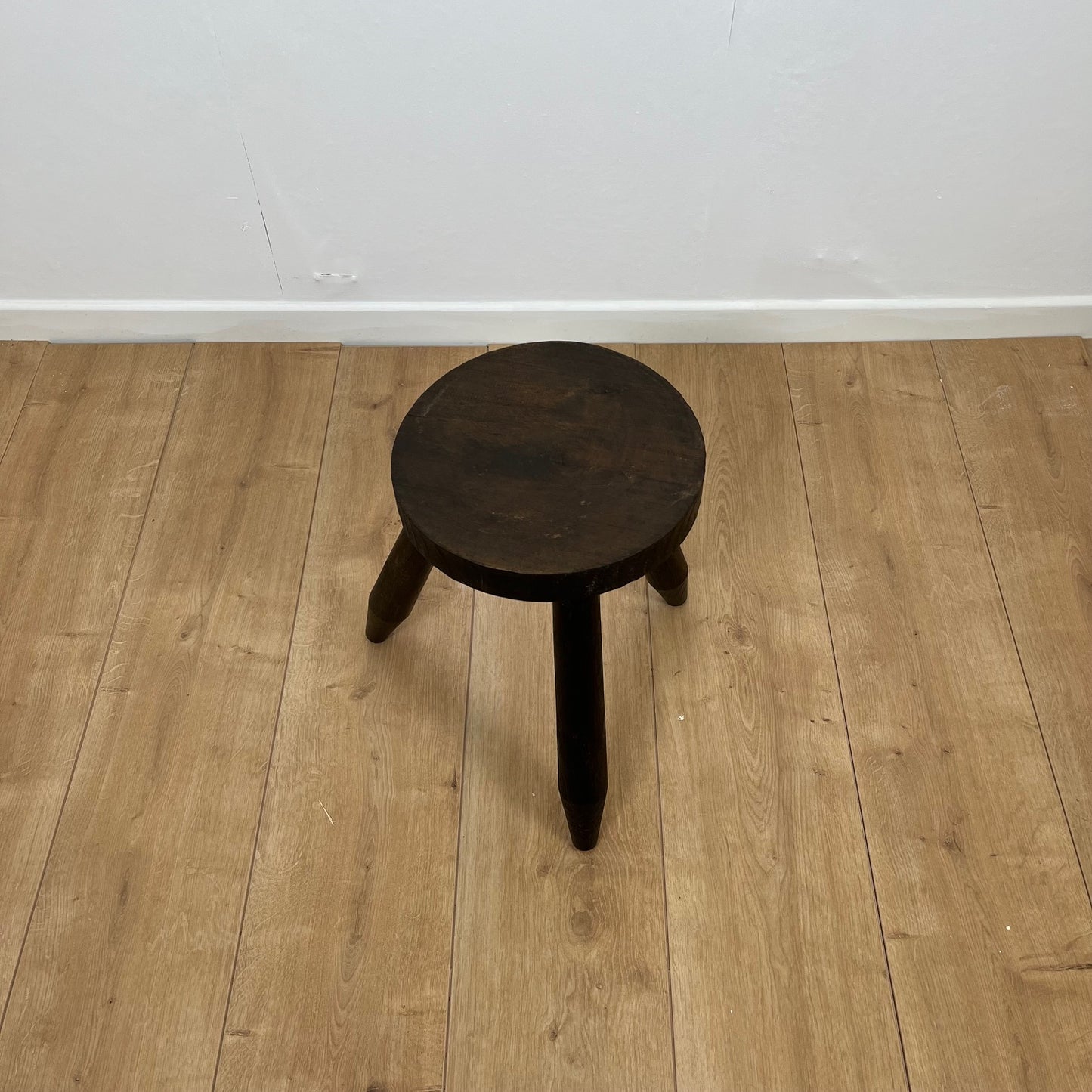 Small brutalist tripod stool in solid wood