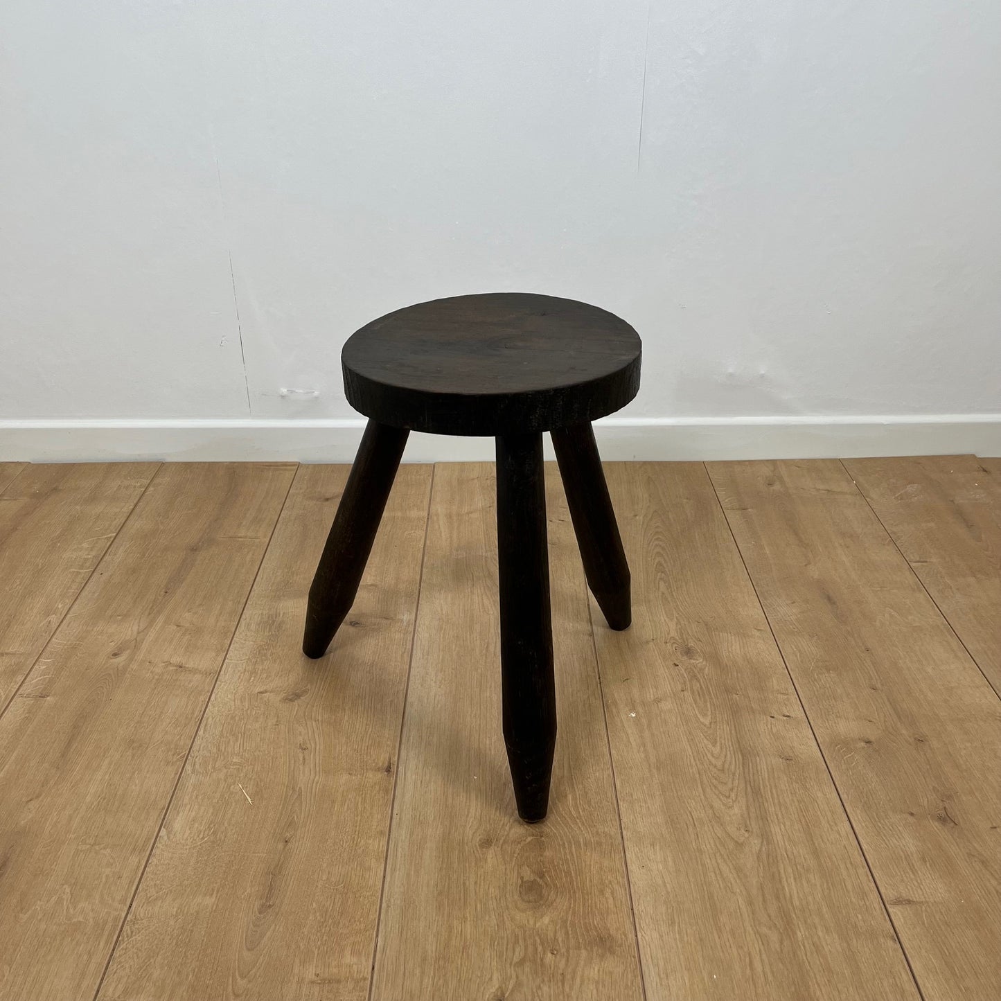 Small brutalist tripod stool in solid wood
