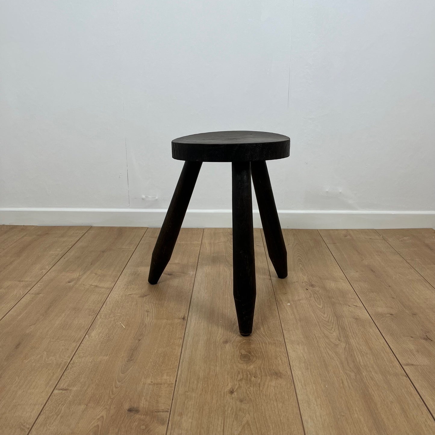 Small brutalist tripod stool in solid wood