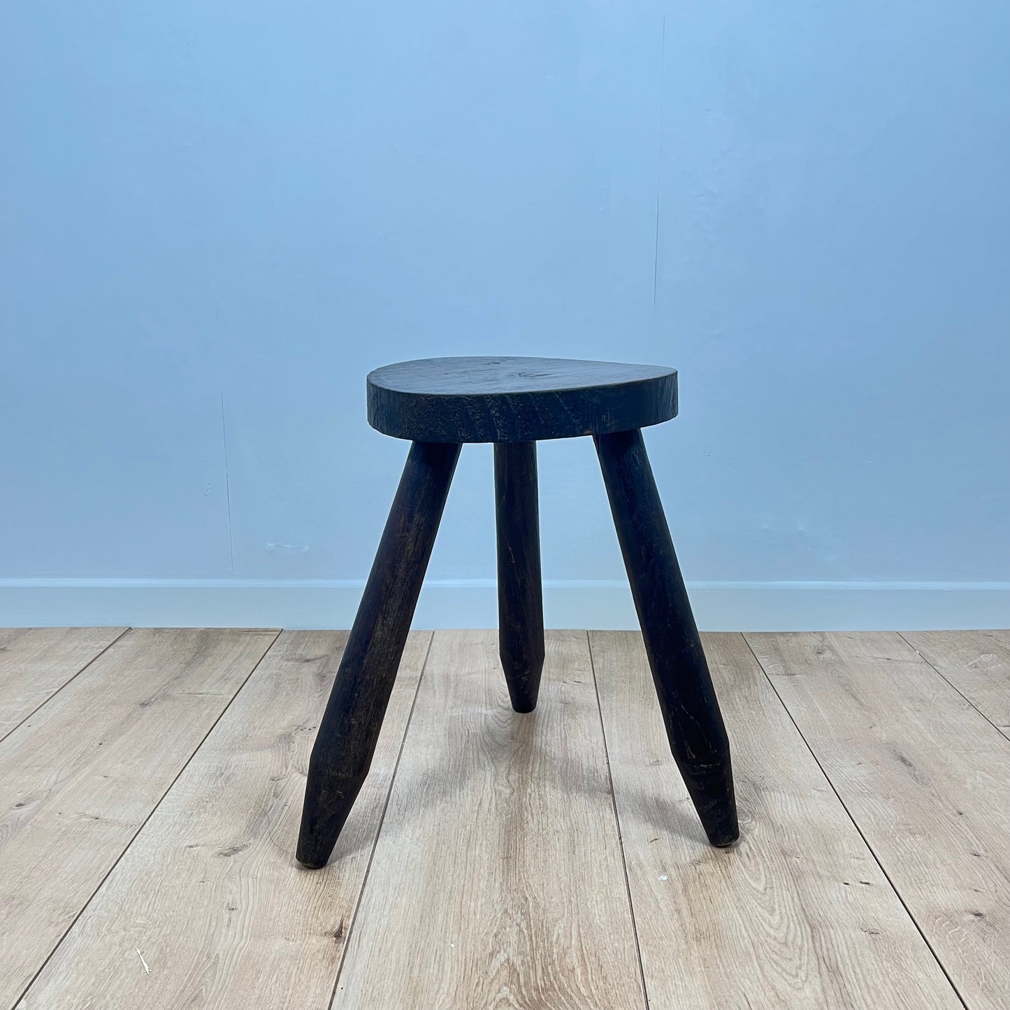 Small brutalist tripod stool in solid wood