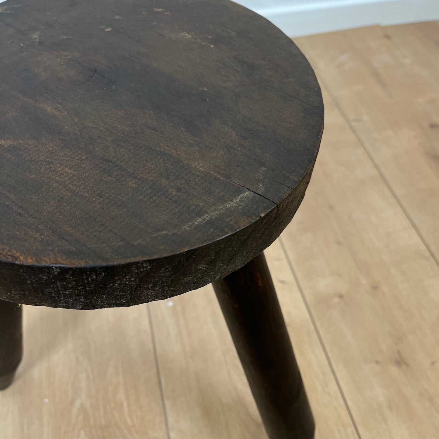 Small brutalist tripod stool in solid wood