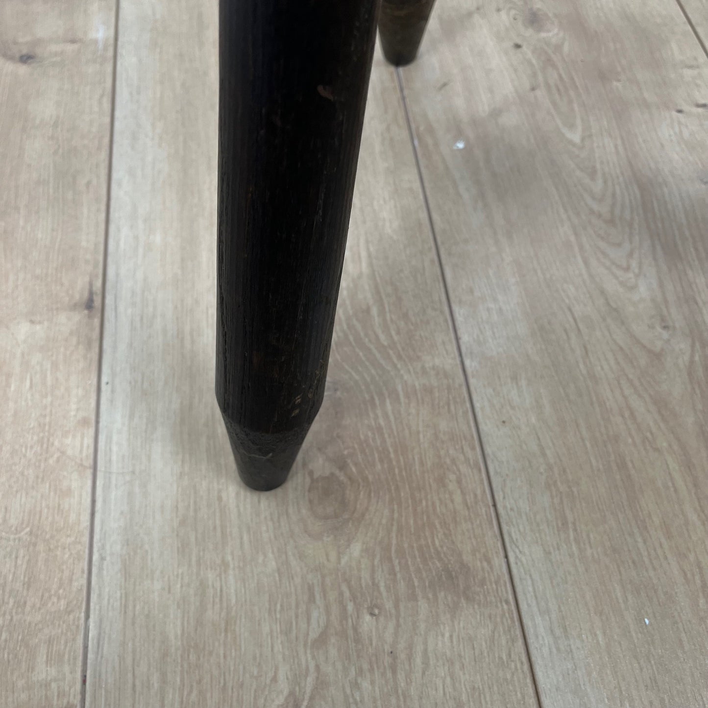 Small brutalist tripod stool in solid wood