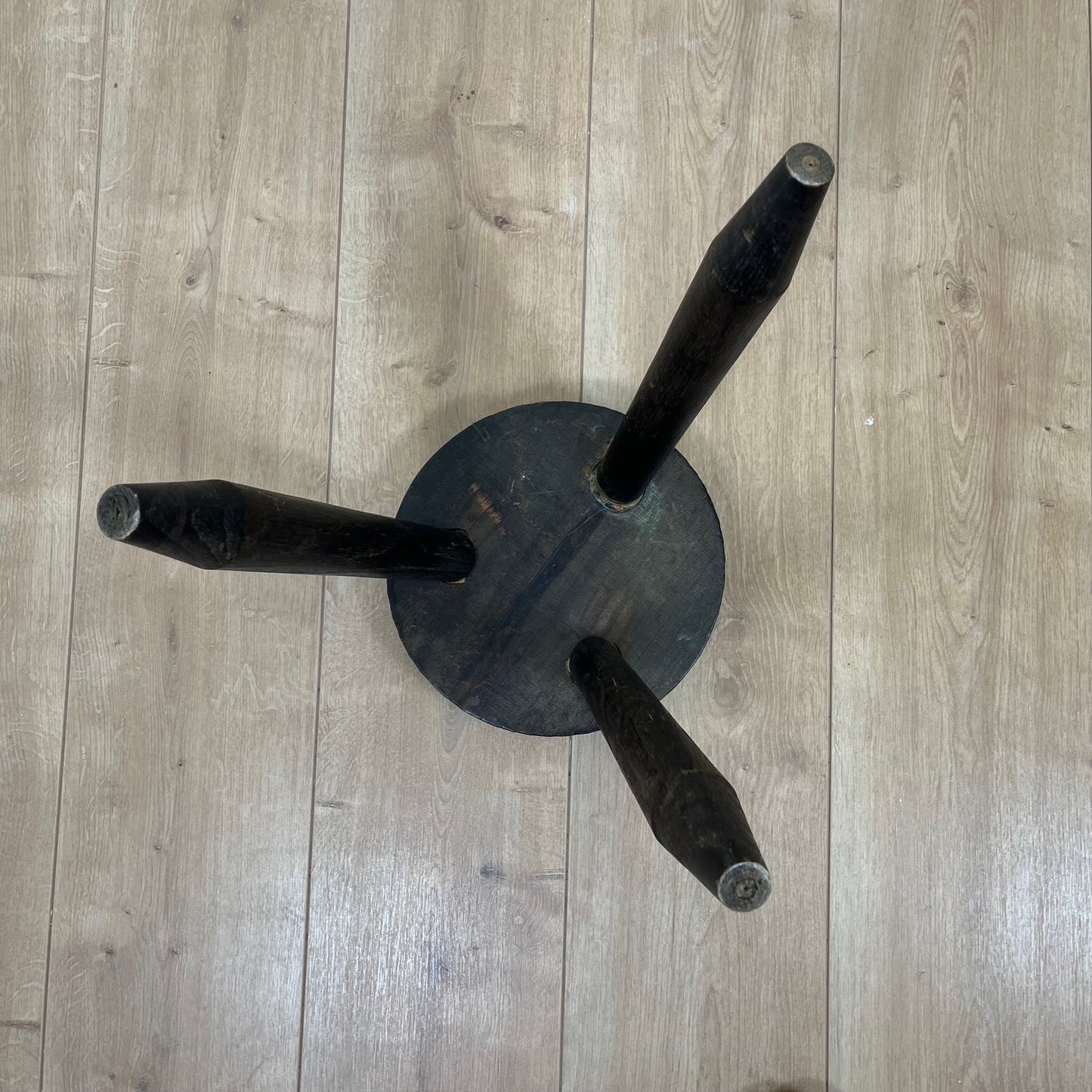 Small brutalist tripod stool in solid wood