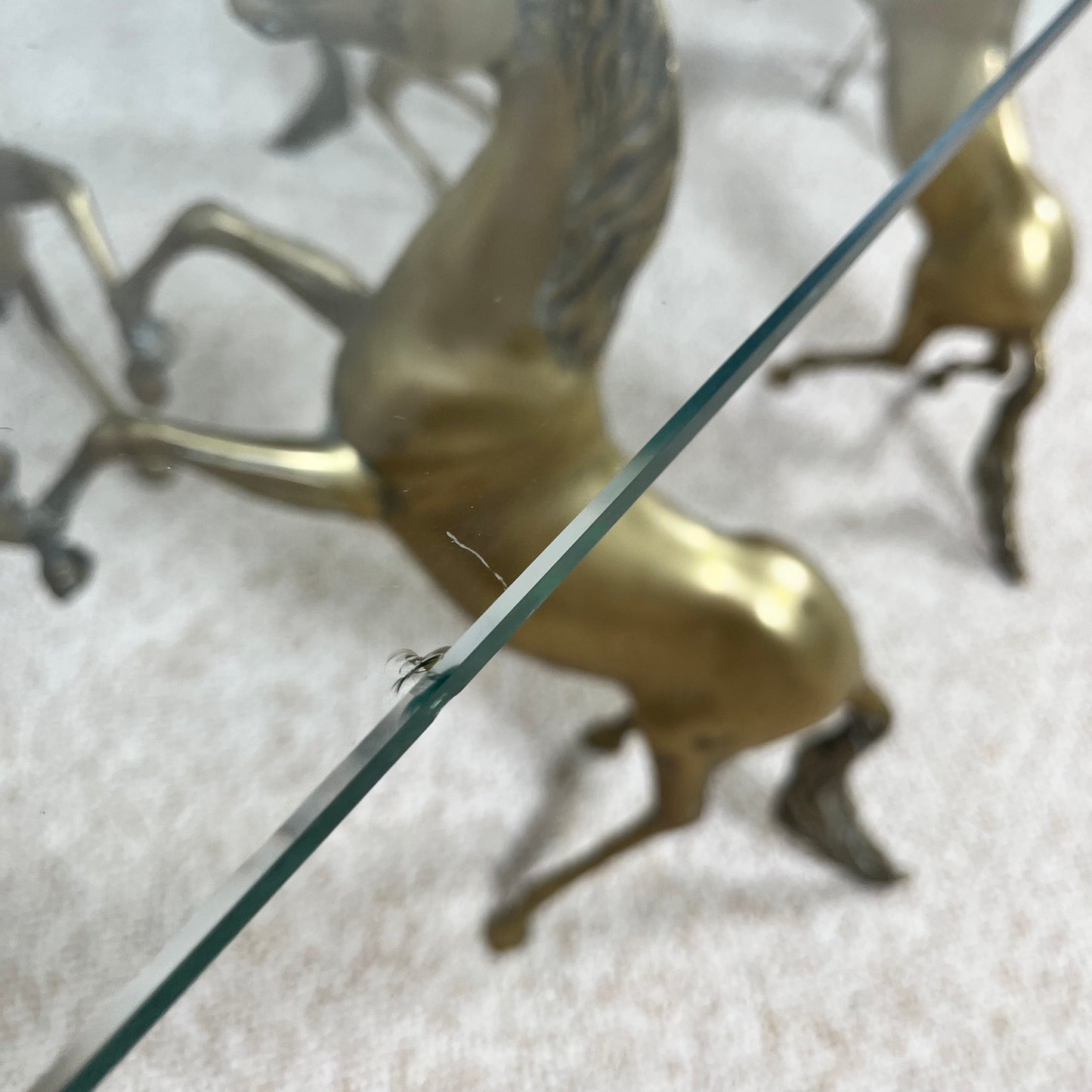 Hollywood Regency style coffee table, 6 patinated brass horses & glass top, 1970