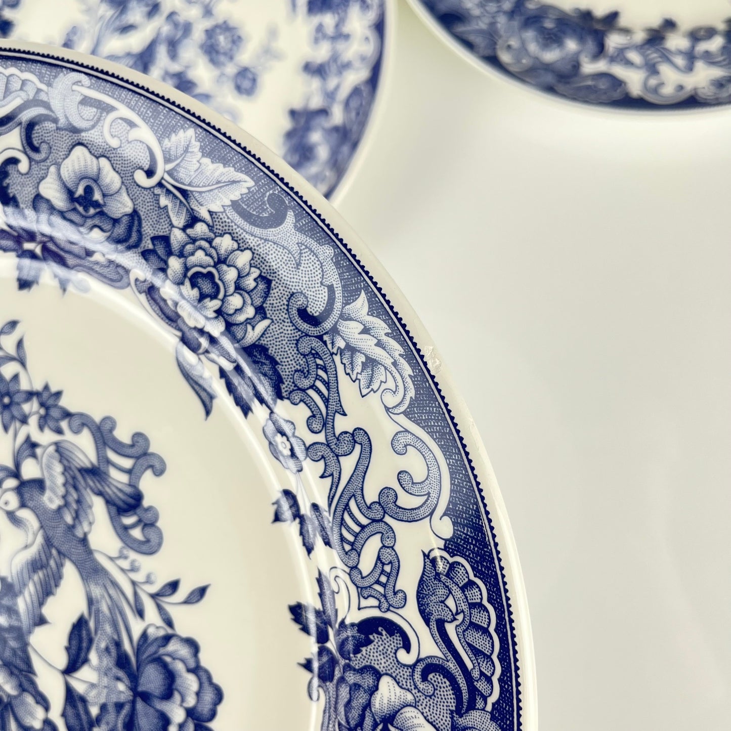 Set of 8 blue earthenware dinner plates with floral and bird decoration, early 20th century