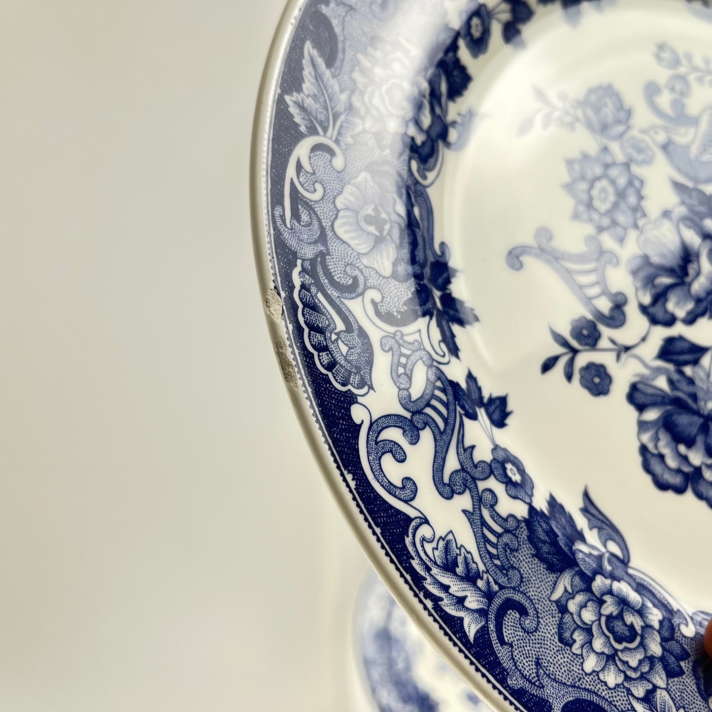 Set of 8 blue earthenware dinner plates with floral and bird decoration, early 20th century