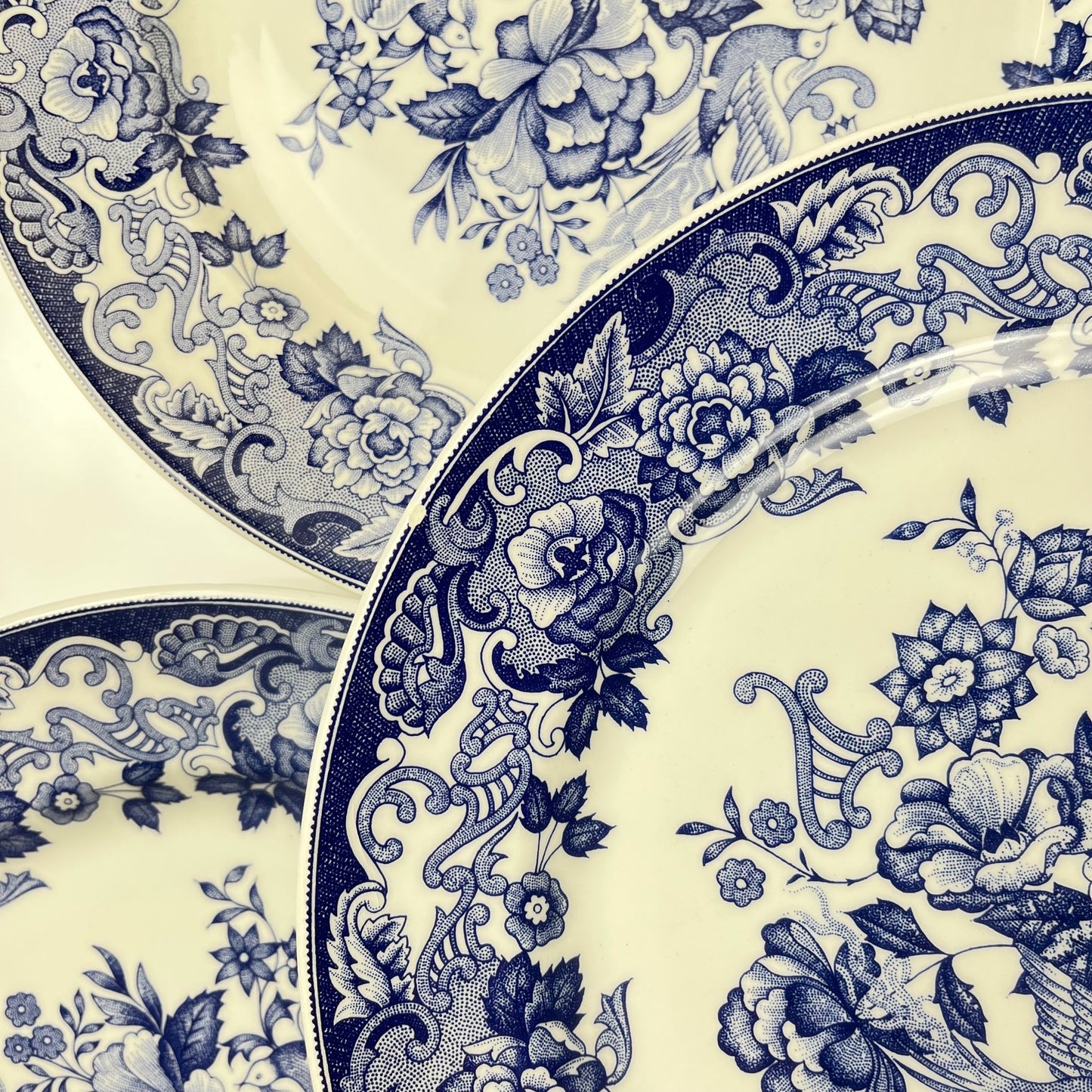 Set of 8 blue earthenware dinner plates with floral and bird decoration, early 20th century