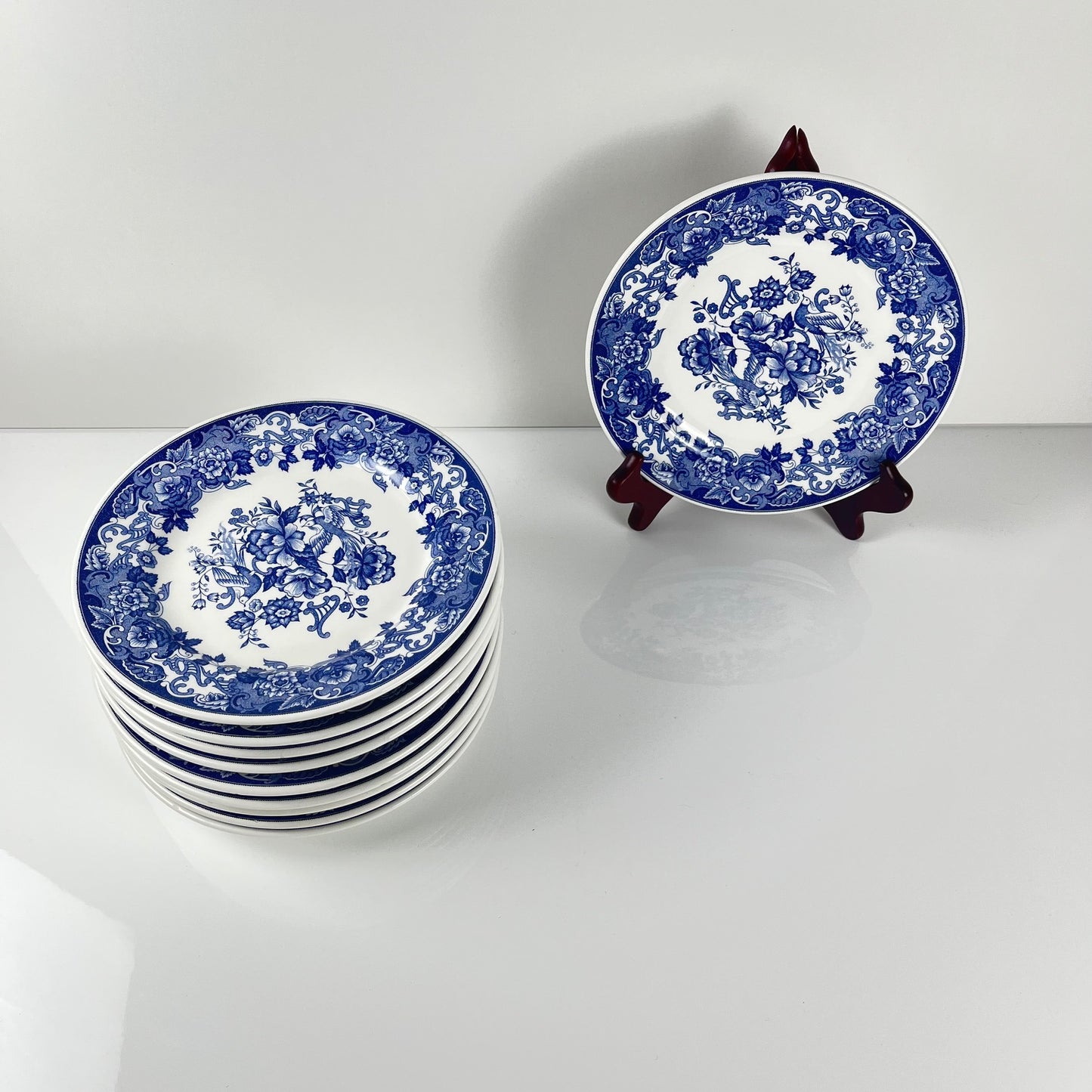 Set of 10 blue earthenware dessert plates with floral and bird decoration, early 20th century