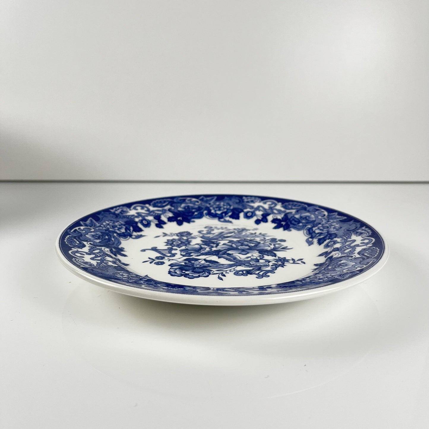 Set of 10 blue earthenware dessert plates with floral and bird decoration, early 20th century