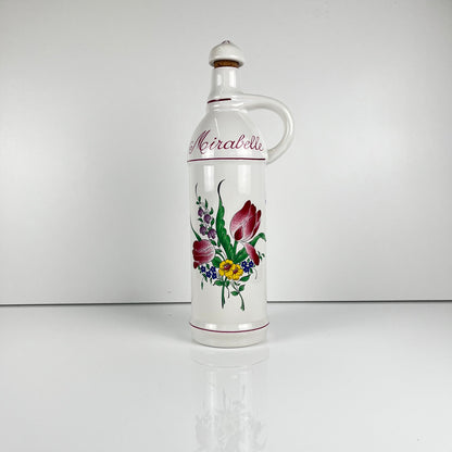 "Mirabelle" bottle, "Réverbère" model by KG Lunéville, tulip and rose pattern.