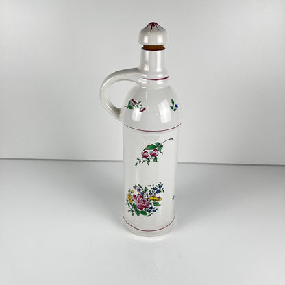 "Mirabelle" bottle, "Réverbère" model by KG Lunéville, tulip and rose pattern.
