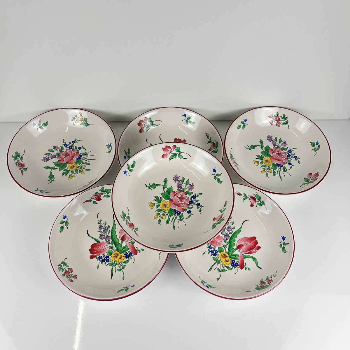 Set of 6 deep plates, "Réverbère" model by KG Lunéville, tulip and rose pattern.