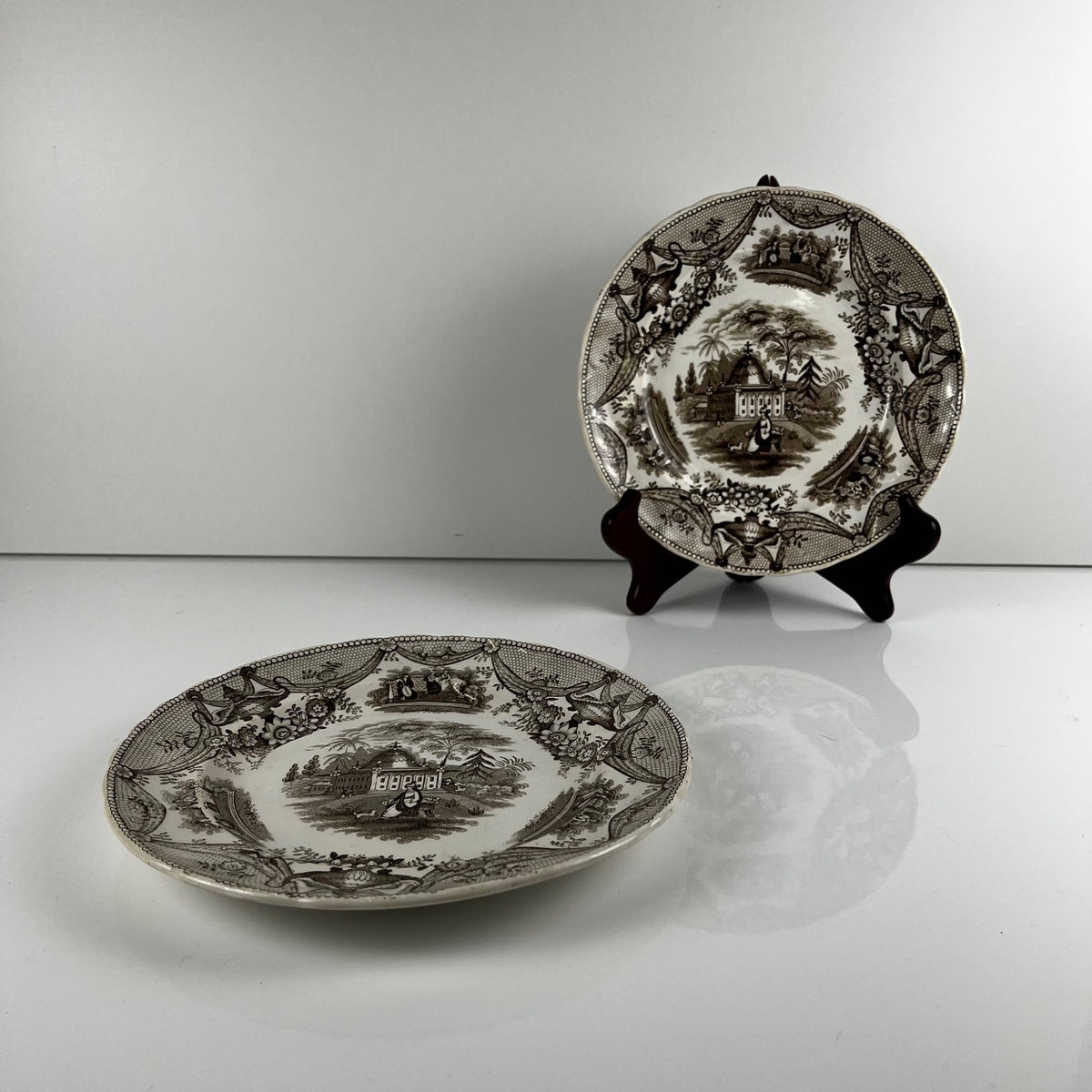 Pair of antique fine earthenware dessert plates by David Johnston (Bordeaux), 19th century.