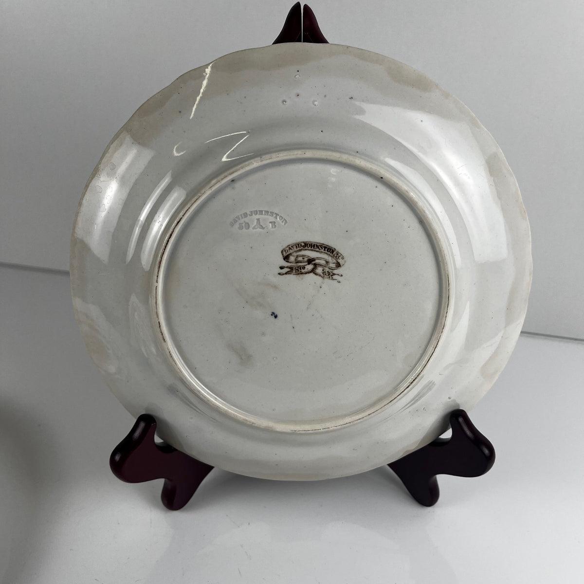 Pair of antique fine earthenware dessert plates by David Johnston (Bordeaux), 19th century.