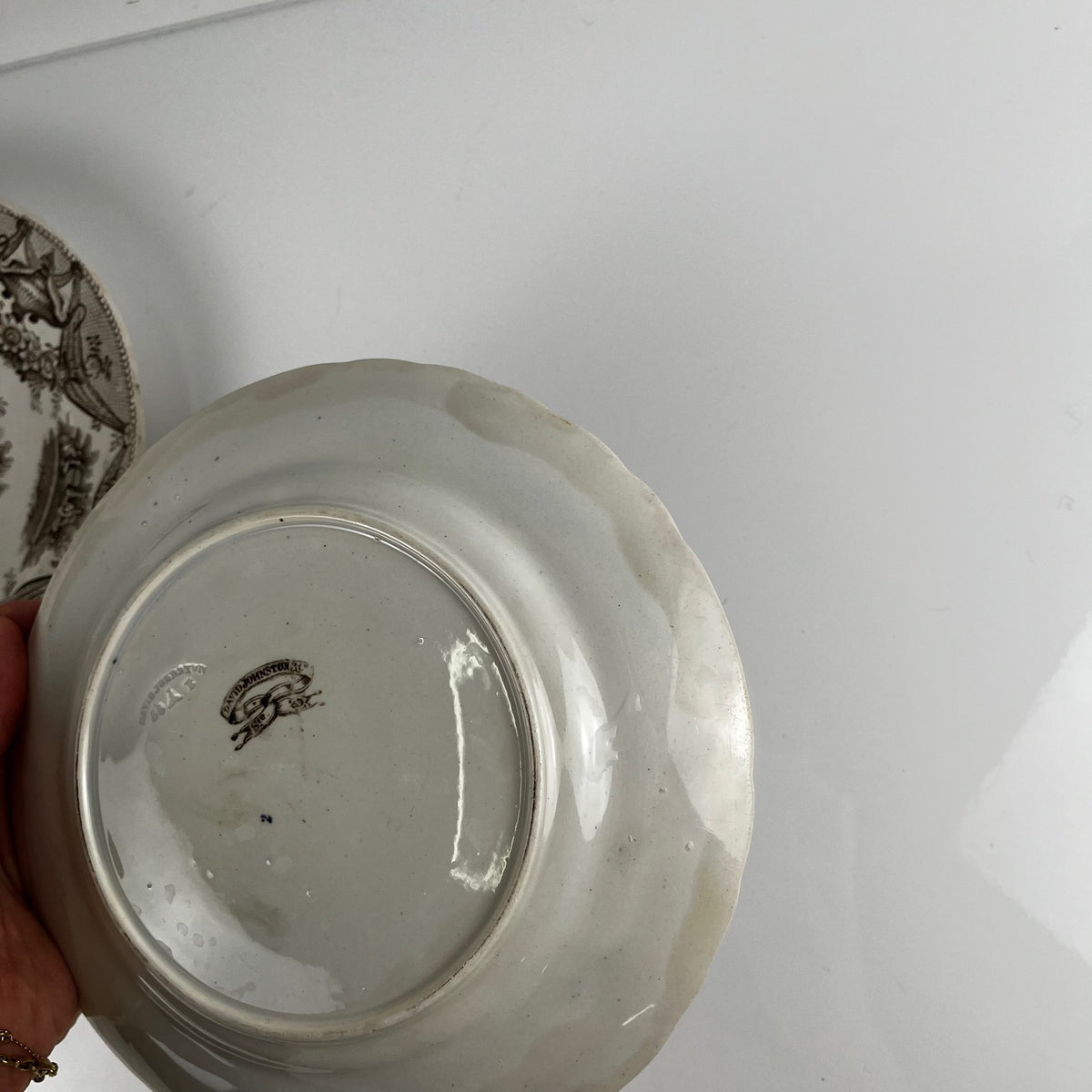 Pair of antique fine earthenware dessert plates by David Johnston (Bordeaux), 19th century.