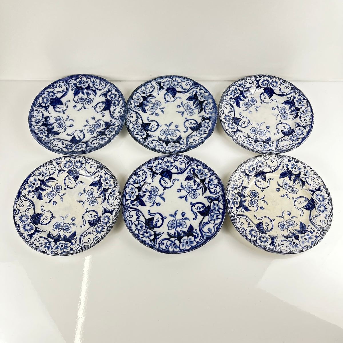 Set of 6 "Flora" *Terre de Fer* dessert plates – Creil et Montereau, 19th century, blue