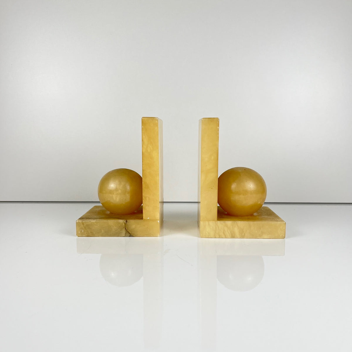Pair of alabaster bookends, cream / yellow color 1970