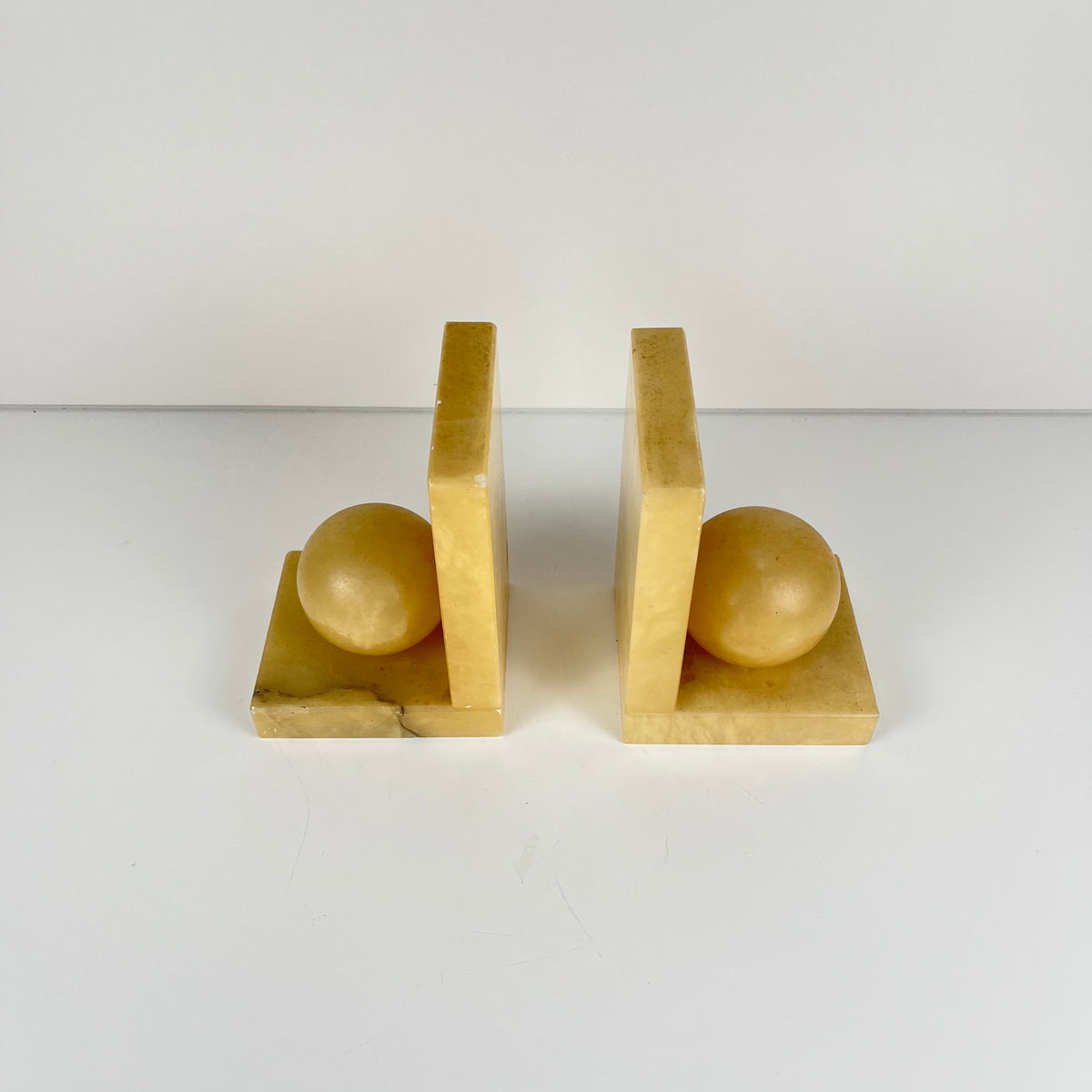 Pair of alabaster bookends, cream / yellow color 1970