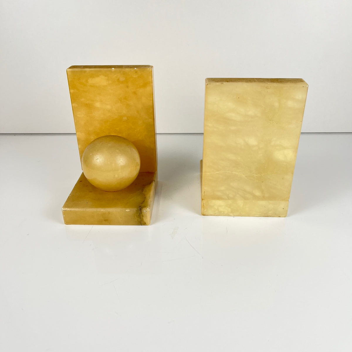 Pair of alabaster bookends, cream / yellow color 1970