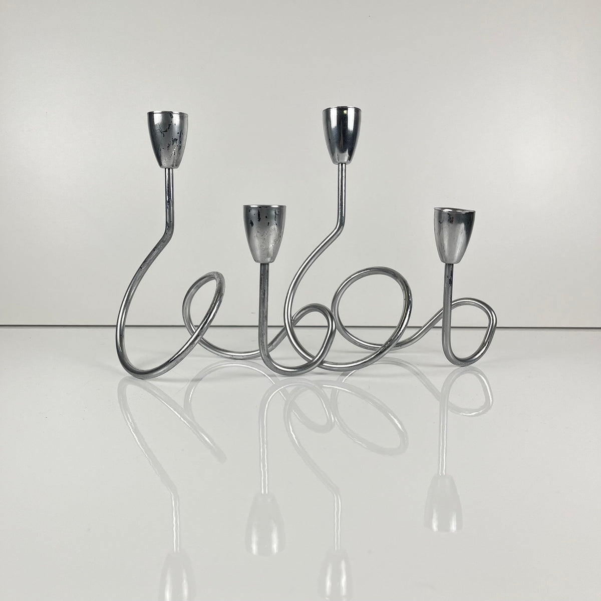 “Loop” style candle holder, 2000, chrome-plated metal