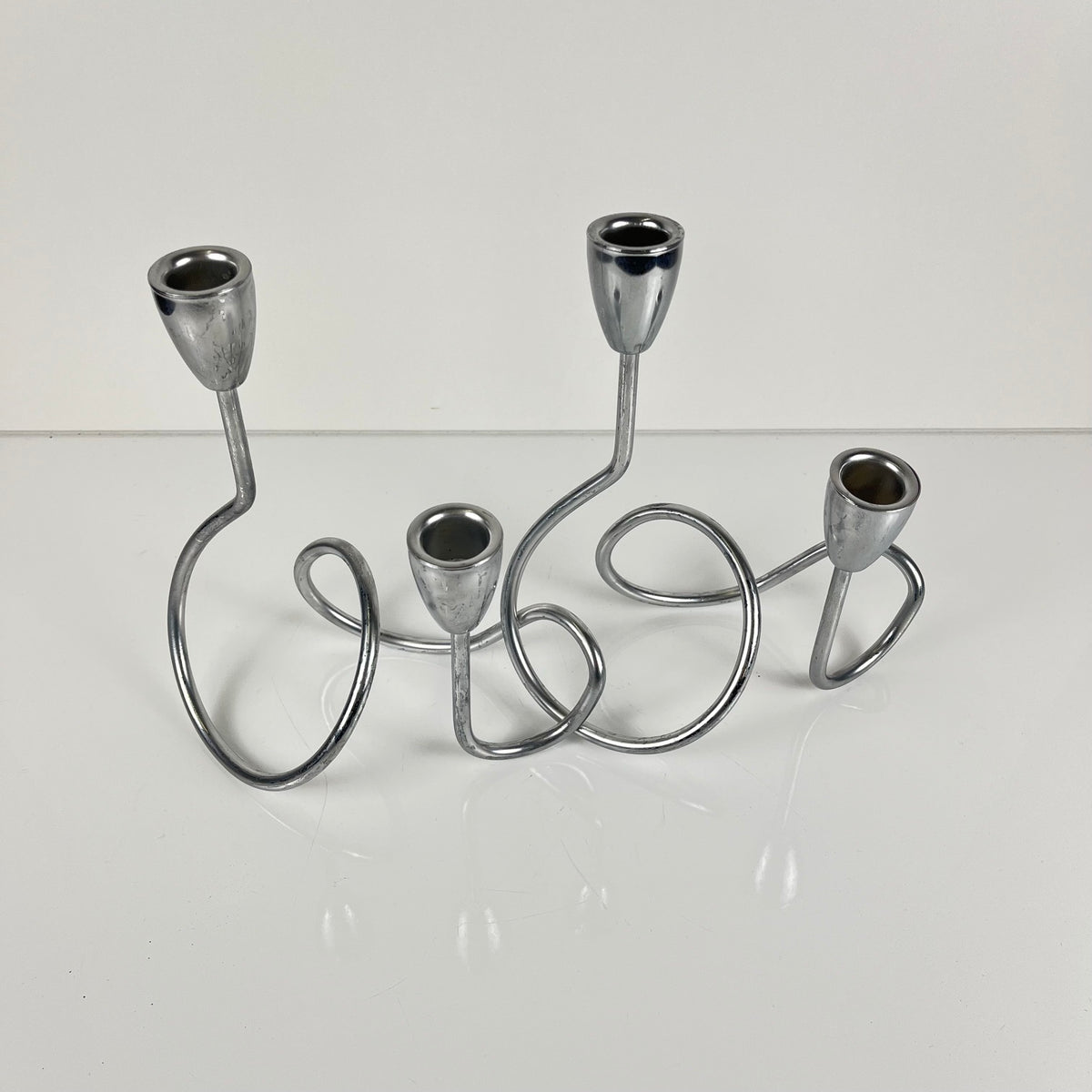 “Loop” style candle holder, 2000, chrome-plated metal