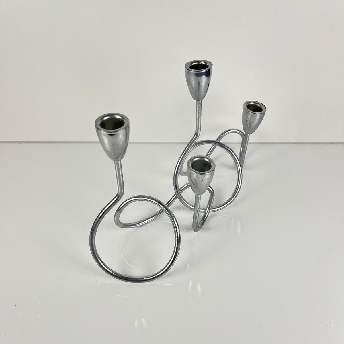 “Loop” style candle holder, 2000, chrome-plated metal