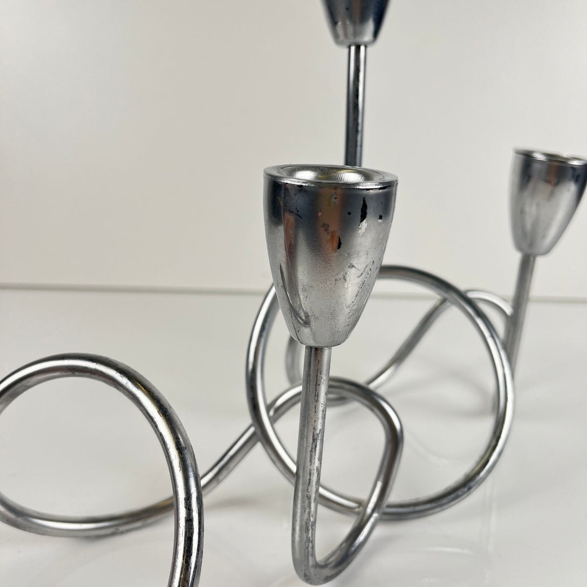 “Loop” style candle holder, 2000, chrome-plated metal