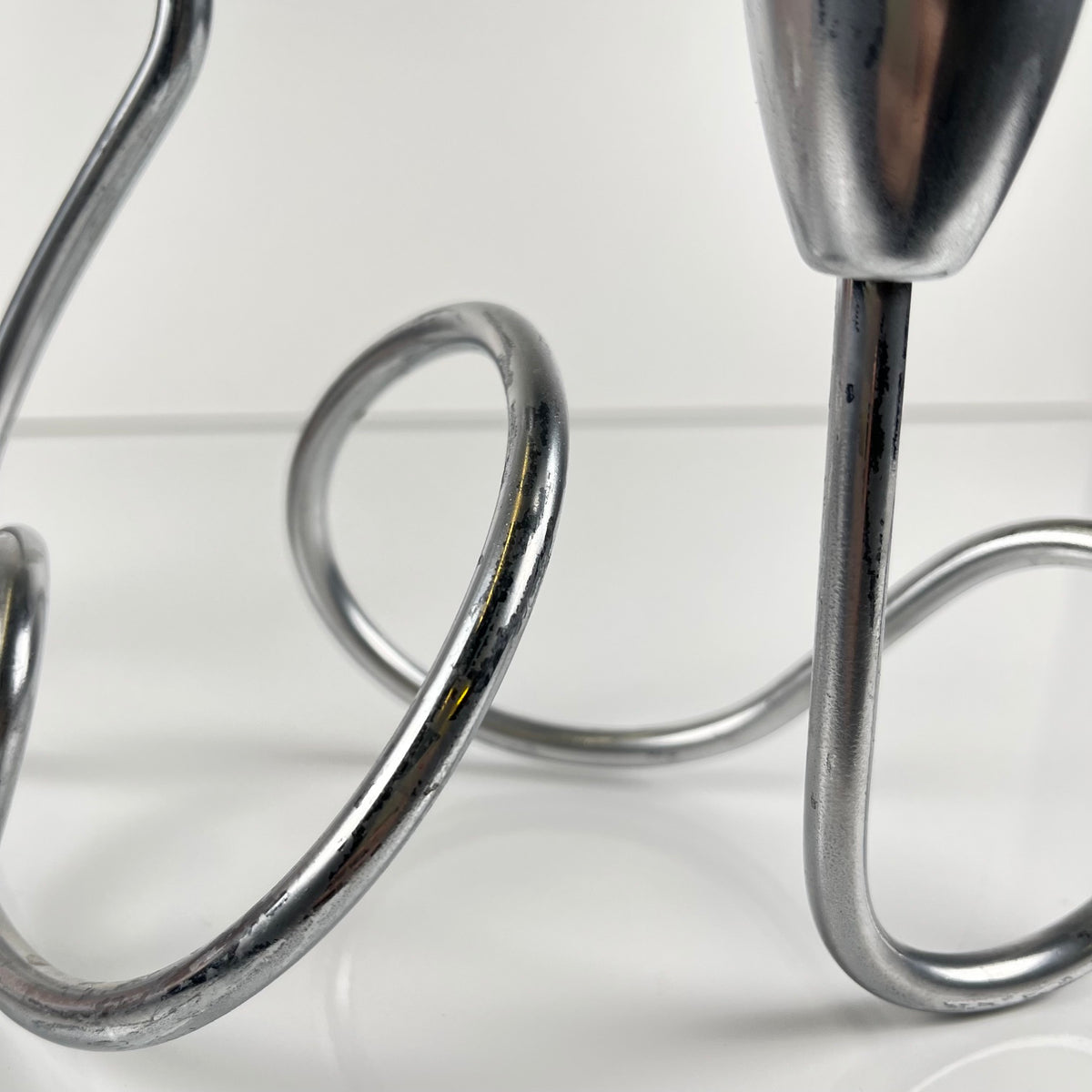 “Loop” style candle holder, 2000, chrome-plated metal