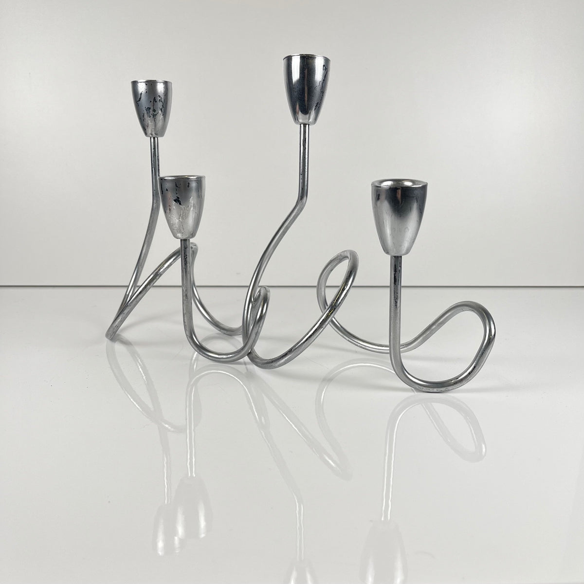 “Loop” style candle holder, 2000, chrome-plated metal