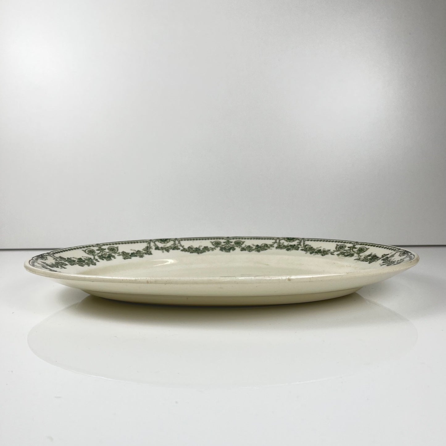 Oval dish, "Champagne" model, Badonviller, green