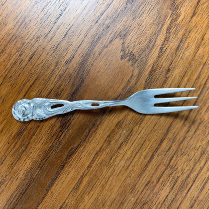 Antique silver metal dessert spoons and forks, flower motif