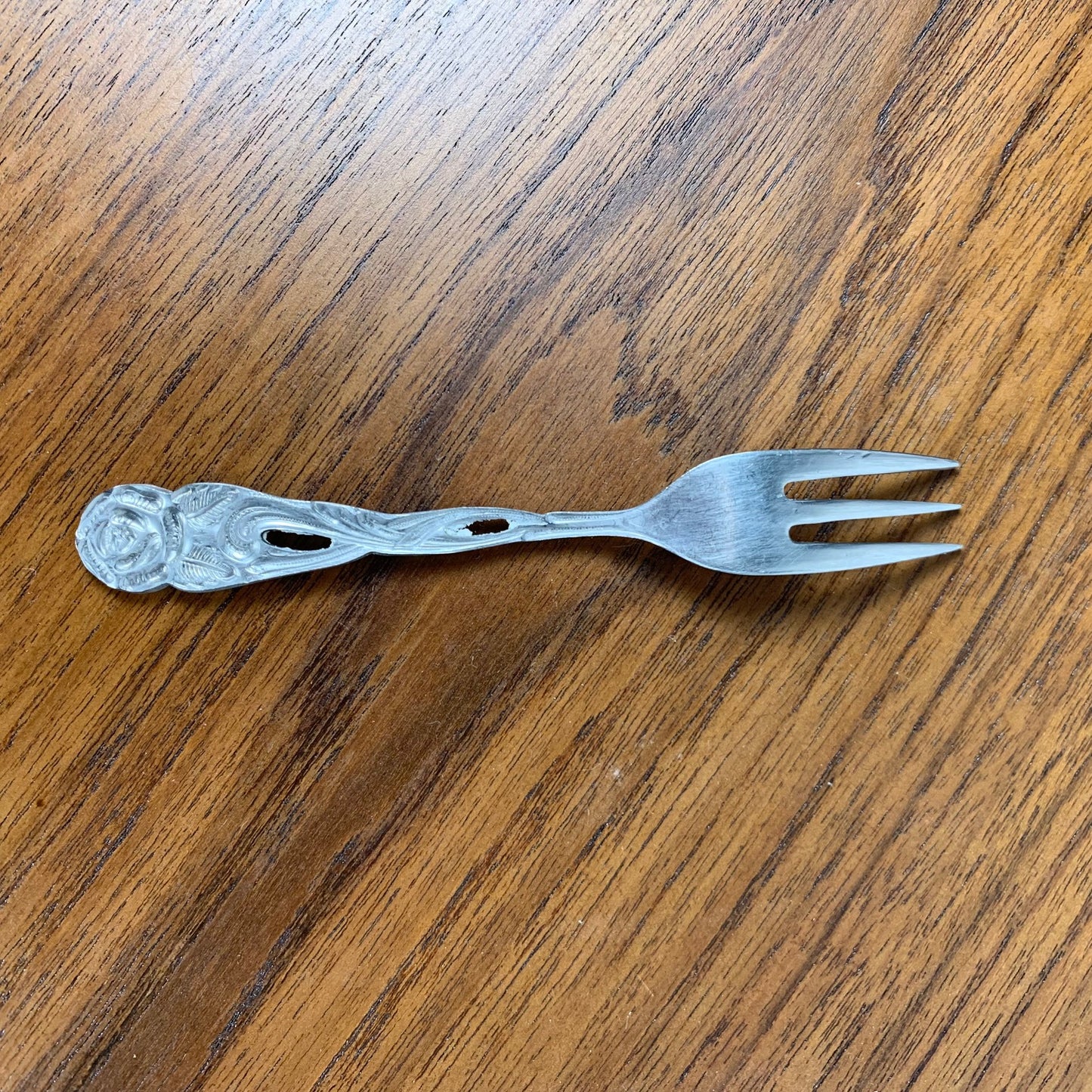 Antique silver metal dessert spoons and forks, flower motif