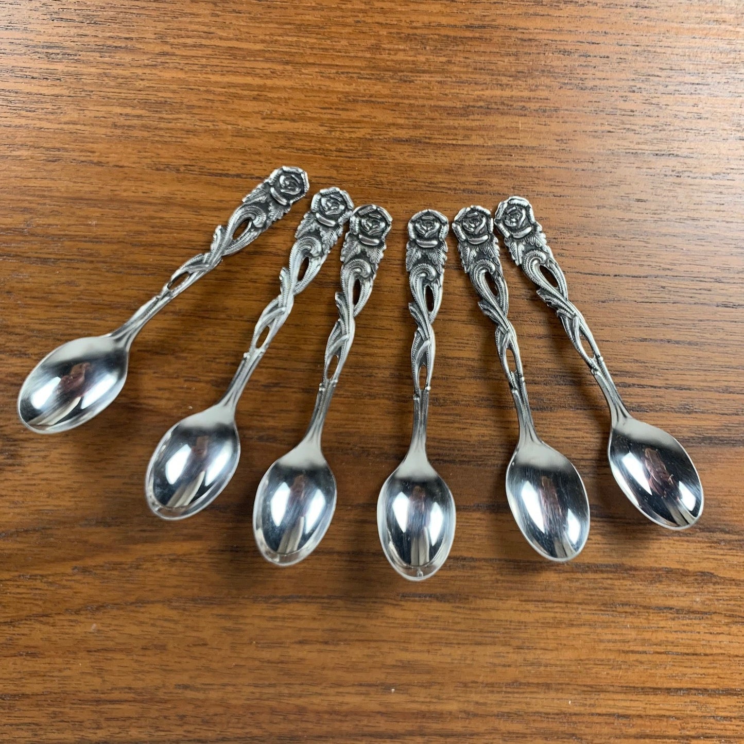 Antique silver metal dessert spoons and forks, flower motif