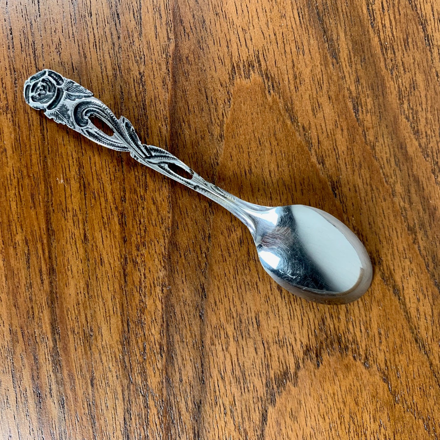 Antique silver metal dessert spoons and forks, flower motif