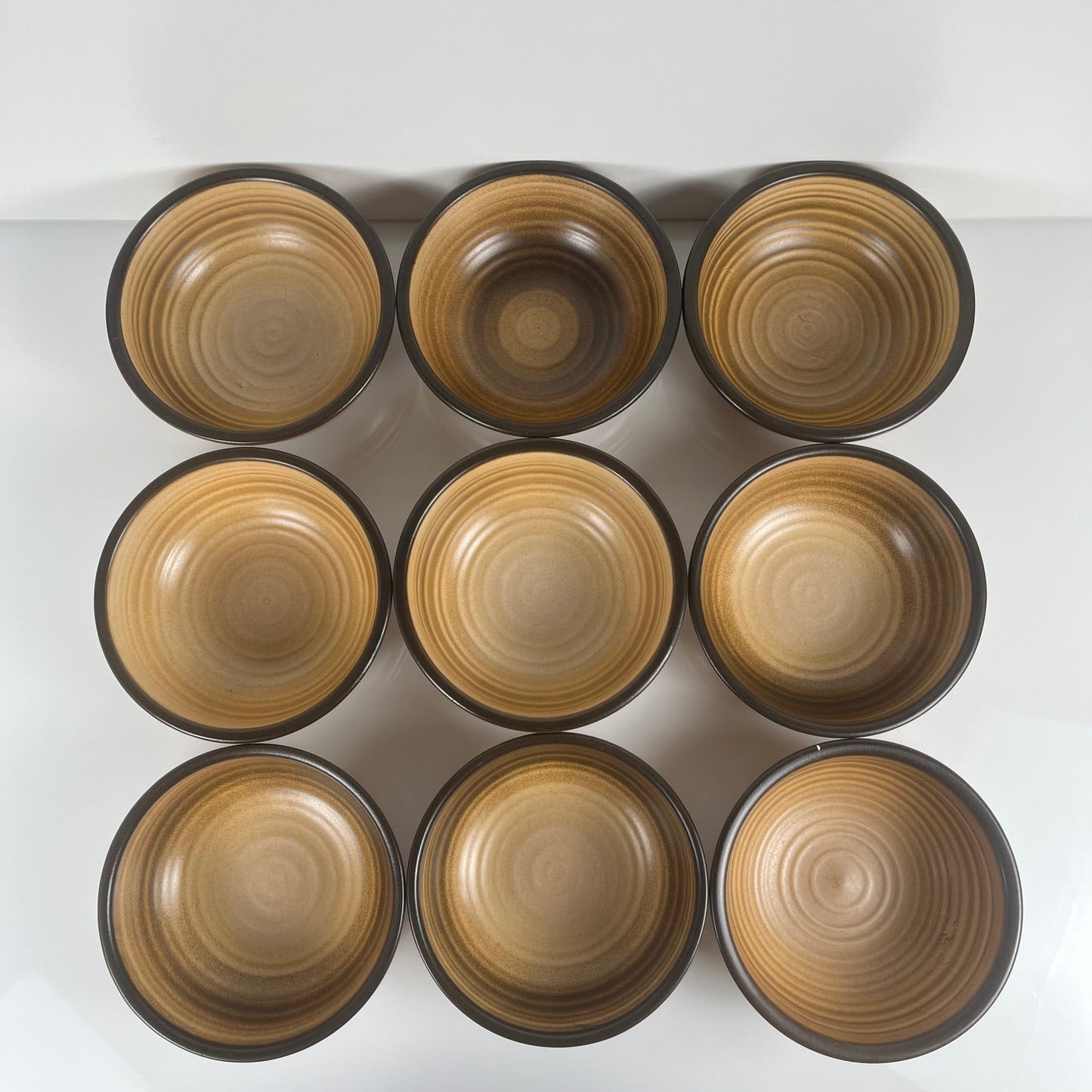 Set of 9 Salins stoneware bowls, brown tones