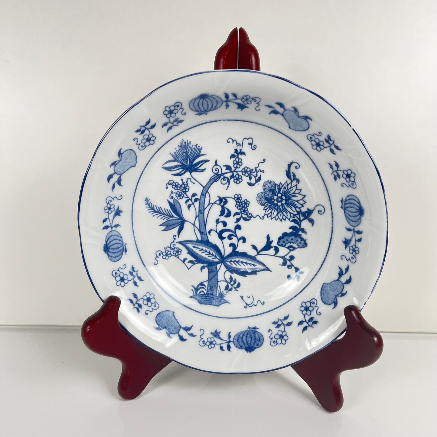 4 bowls/cups with blue onion pattern