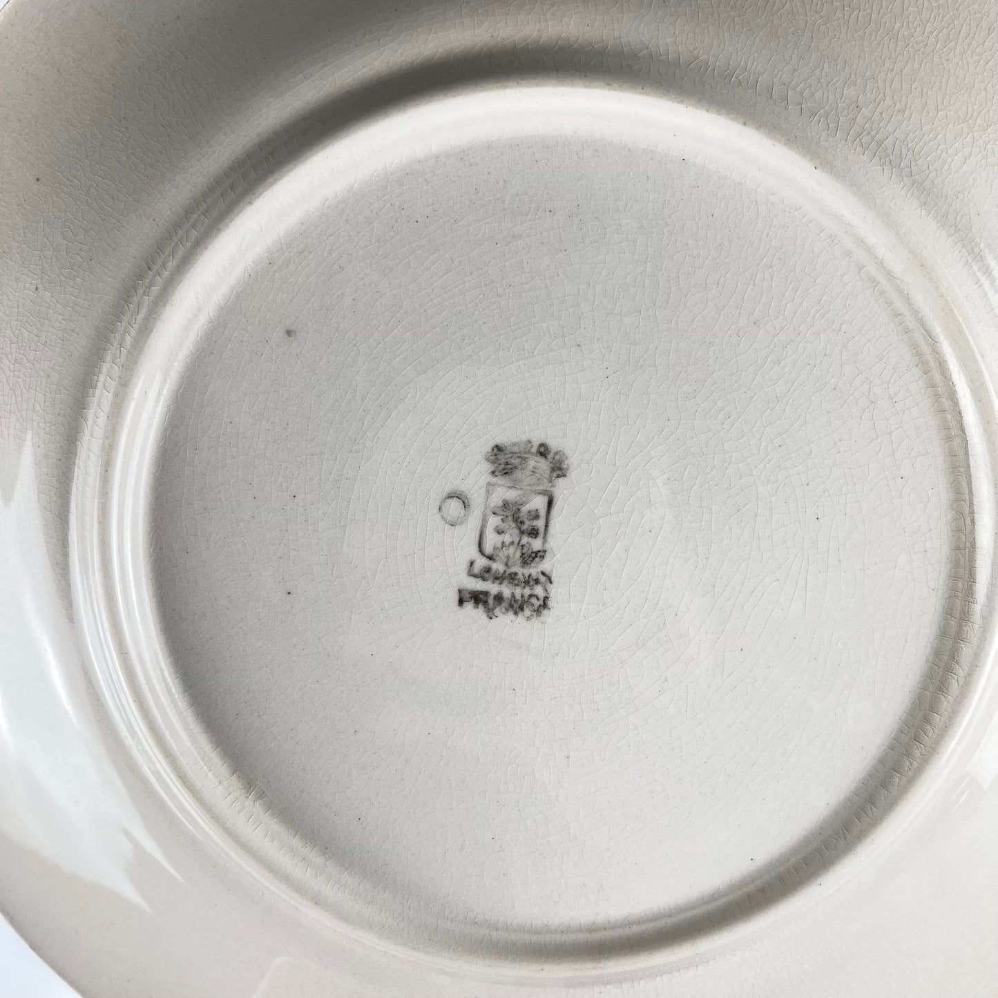 Set de 10 assiettes plates Longwy , début XXème s. , décor Floral