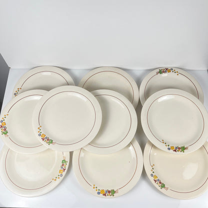 Set de 10 assiettes plates Longwy , début XXème s. , décor Floral