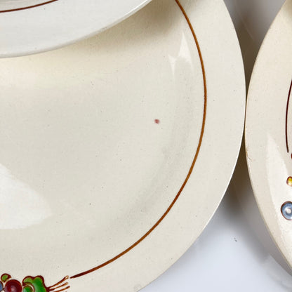 Set de 10 assiettes plates Longwy , début XXème s. , décor Floral