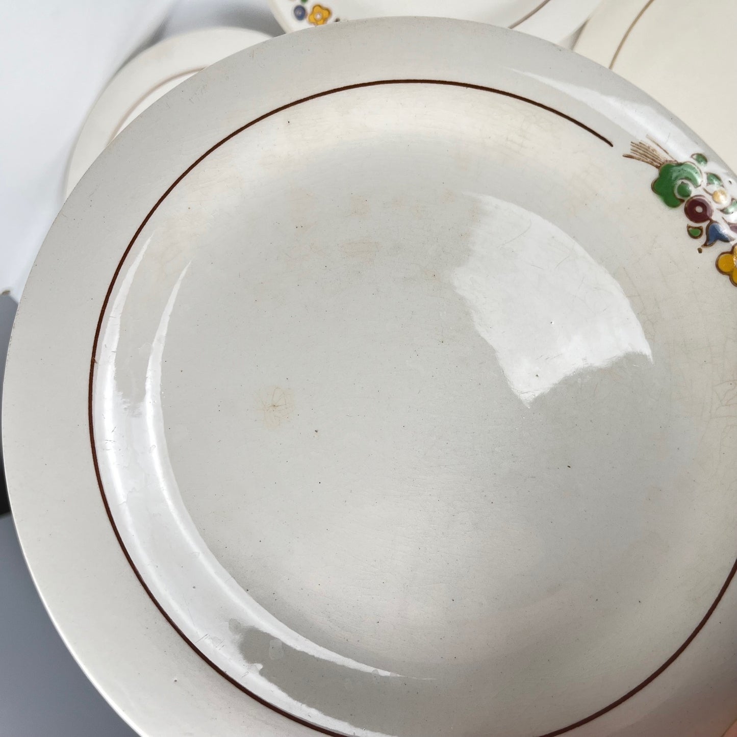 Set de 10 assiettes plates Longwy , début XXème s. , décor Floral