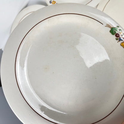 Set de 10 assiettes plates Longwy , début XXème s. , décor Floral