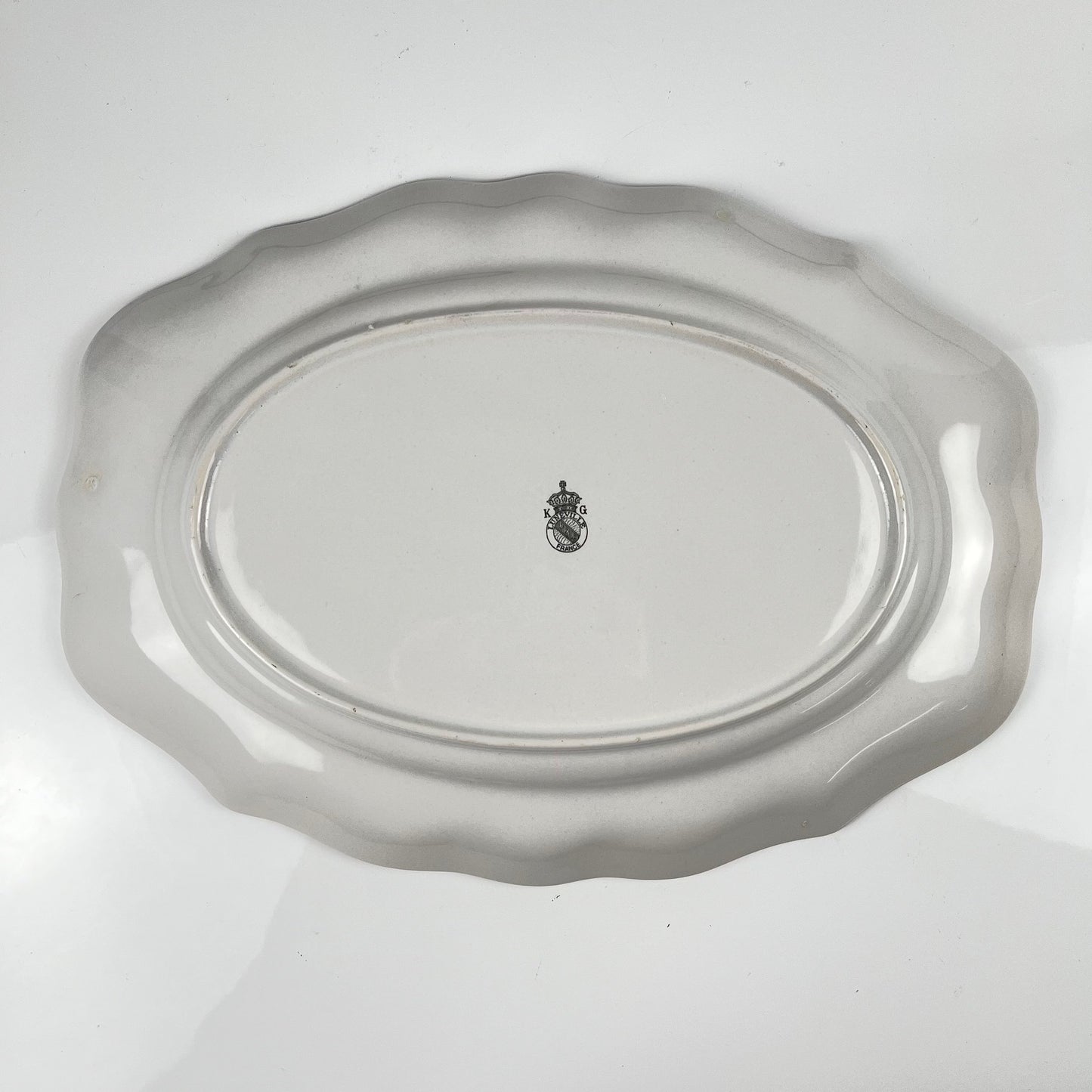 Oval dish with flat end, Réverbère model by KG Lunéville