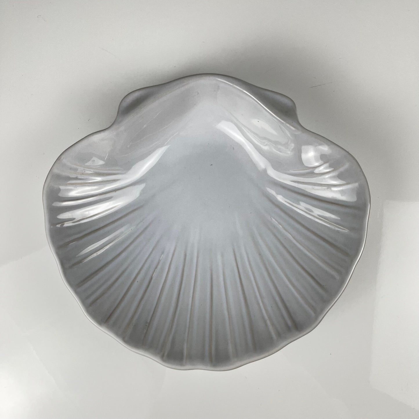 Large platter in the shape of a scallop shell, Emile Henry, France, mid-20th century