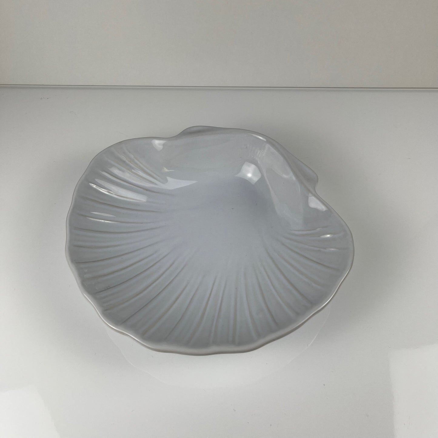 Large platter in the shape of a scallop shell, Emile Henry, France, mid-20th century